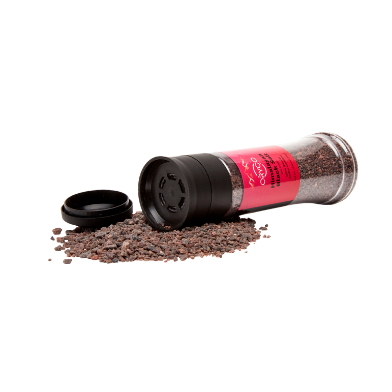 Spice grinder with red label and black lid on a white background
