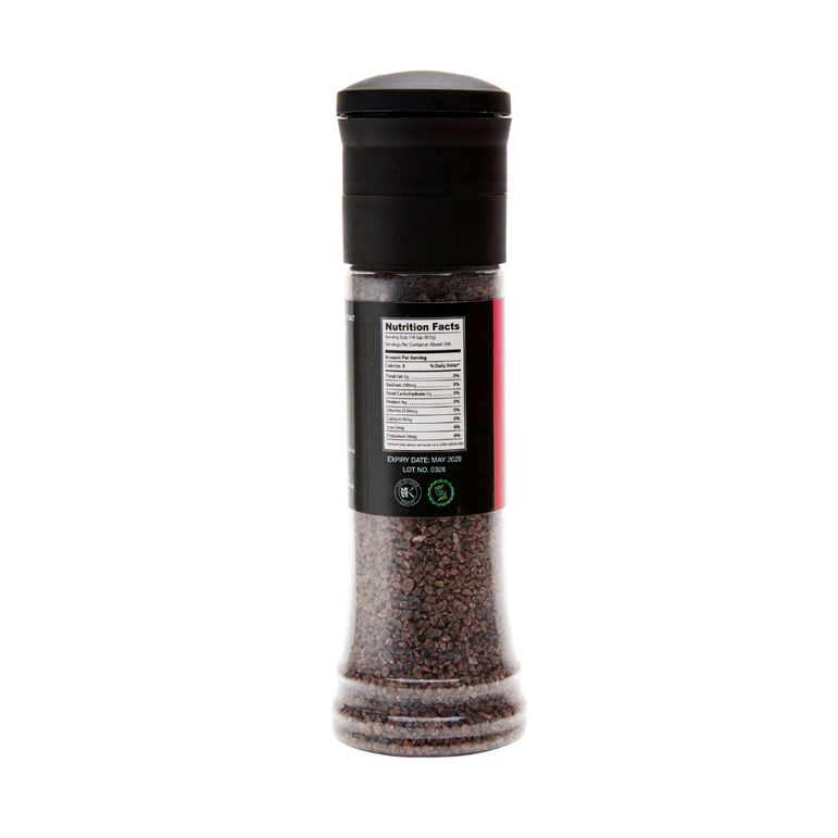 Black pepper grinder with label on a white background