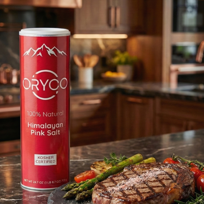 Himalayan Pink Salt can on a kitchen counter with a cooked steak and vegetables.